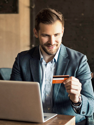 Man looking at a credit card