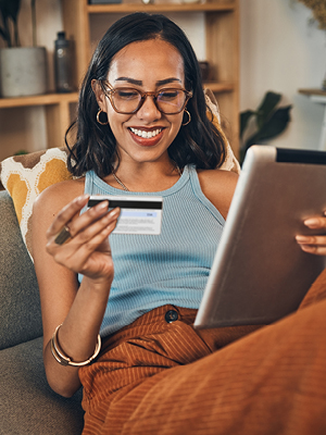 woman looking at her debit card