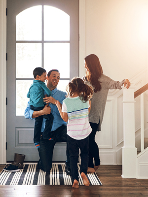 A family meeting at the front door inside their house