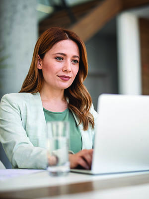 woman looking at her computer