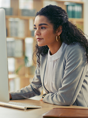 woman looking at her computer