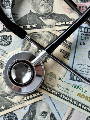 a stethoscope and money