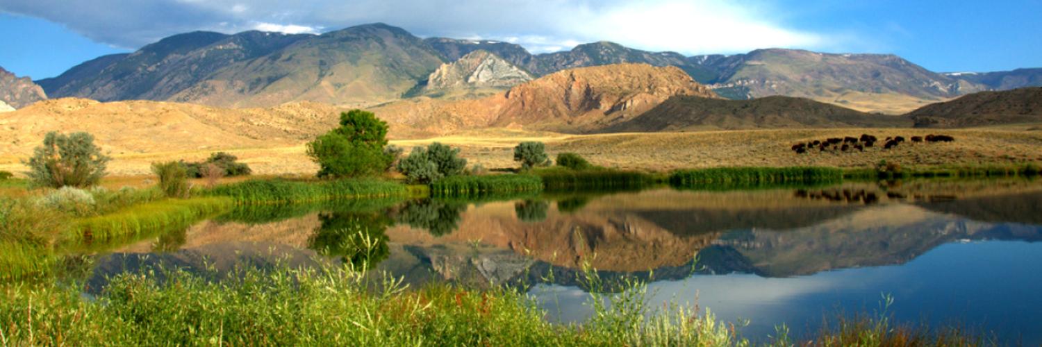 mountains surrounding a beautiful lake