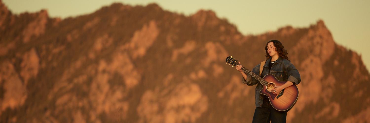 Woman playing a guitar