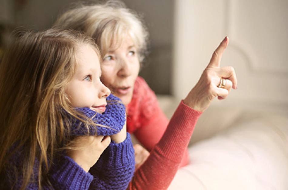 woman and child pointing out window