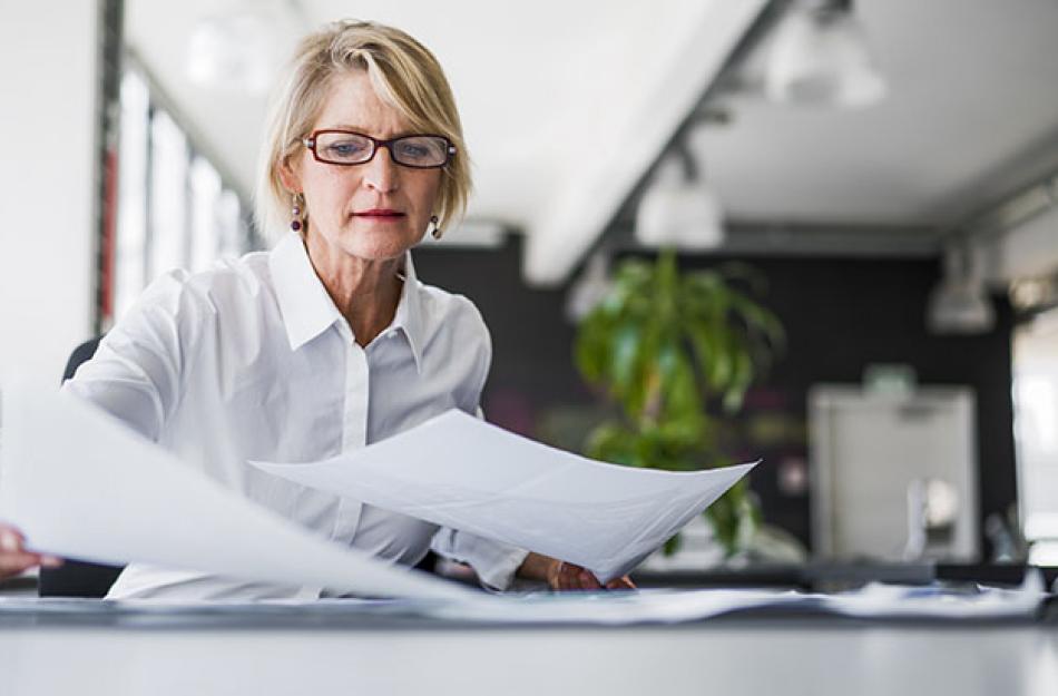 woman looking through some papers