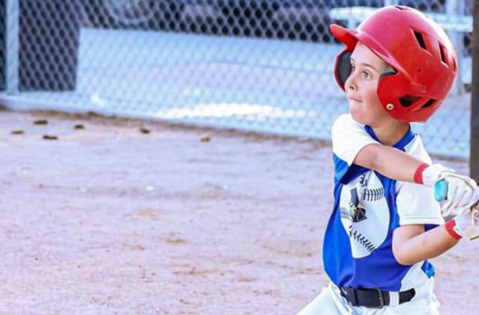 young baseball player getting ready to bat