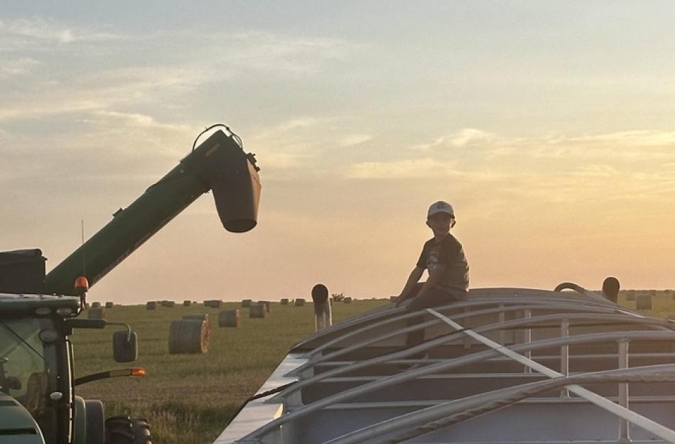 child on a grain truck