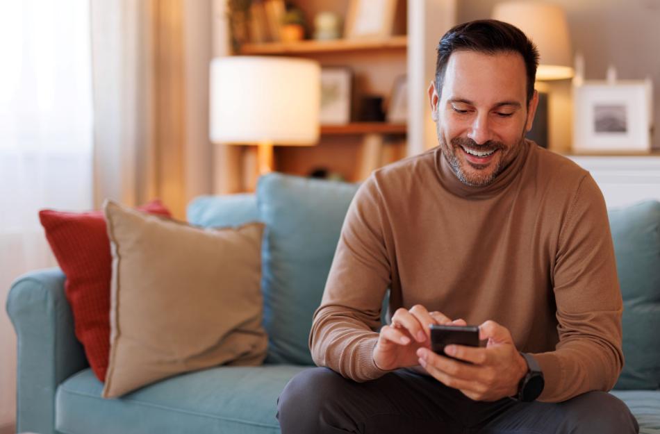 man looking at his phone