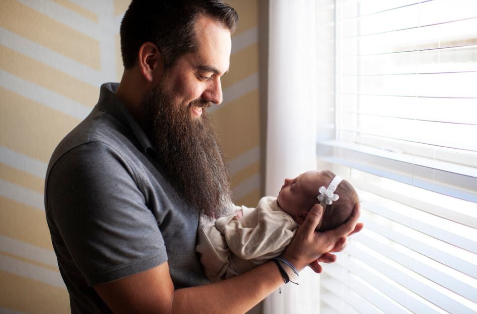 man holding a baby
