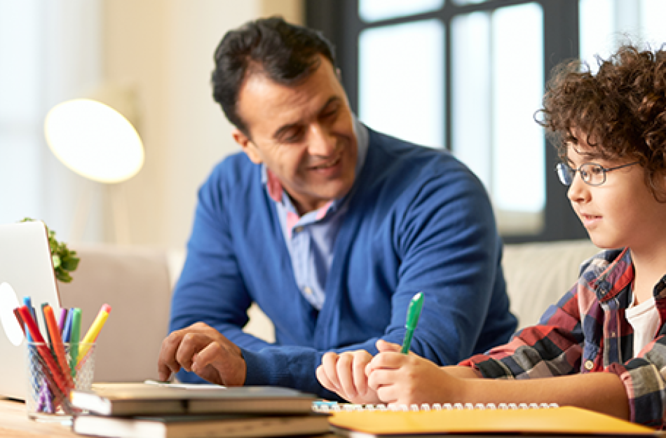 man doing homework with a boy