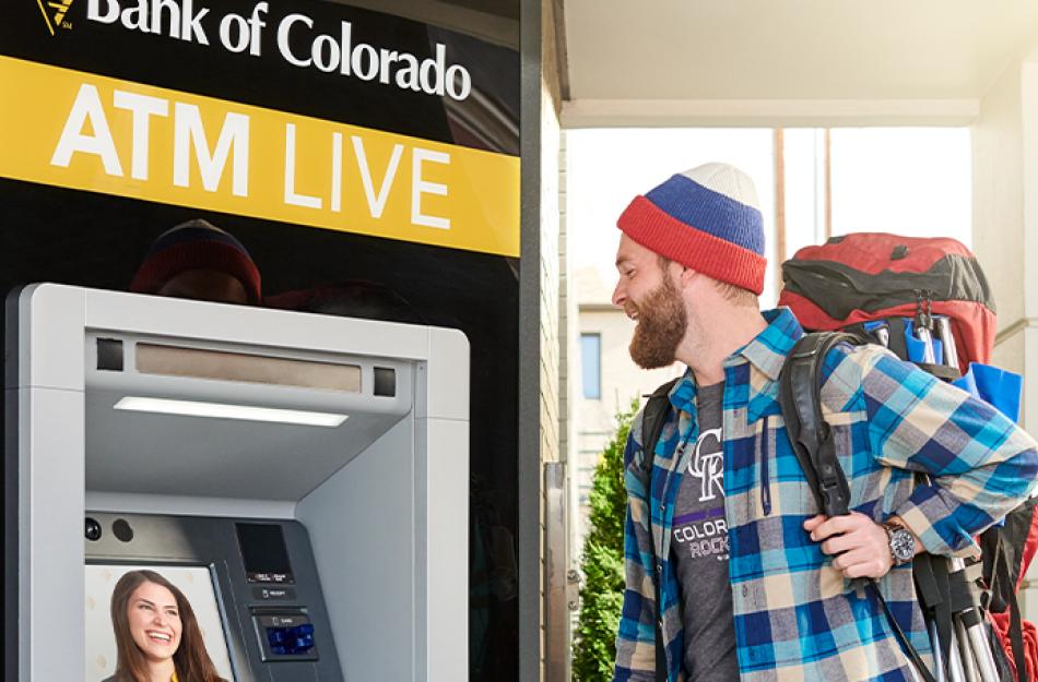 picture of someone at an ATM LIVE machine