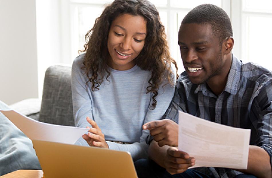 picture of a couple looking at the computer