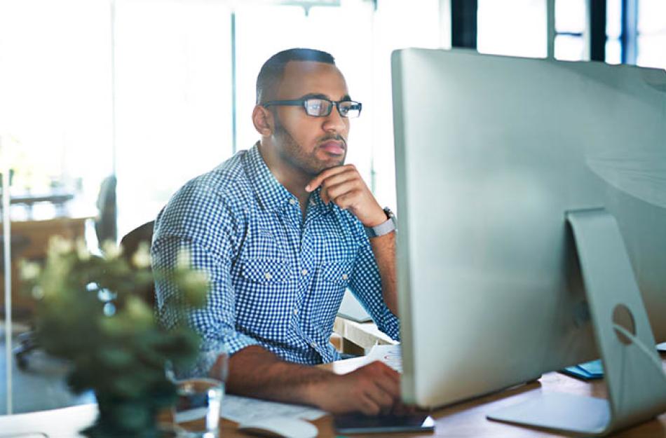 picture of a man working at his computer