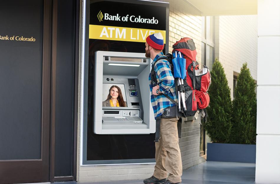 man using an ATM