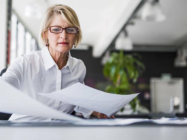 woman looking through some papers